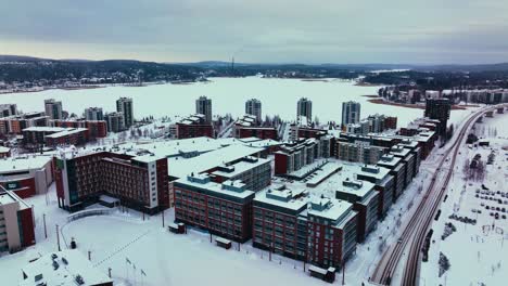 aerial overview of the lutakko district of jyvaskyla, winter evening in finland