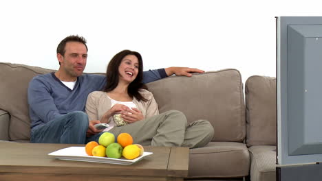 Couple-watching-television-with-popcorn-