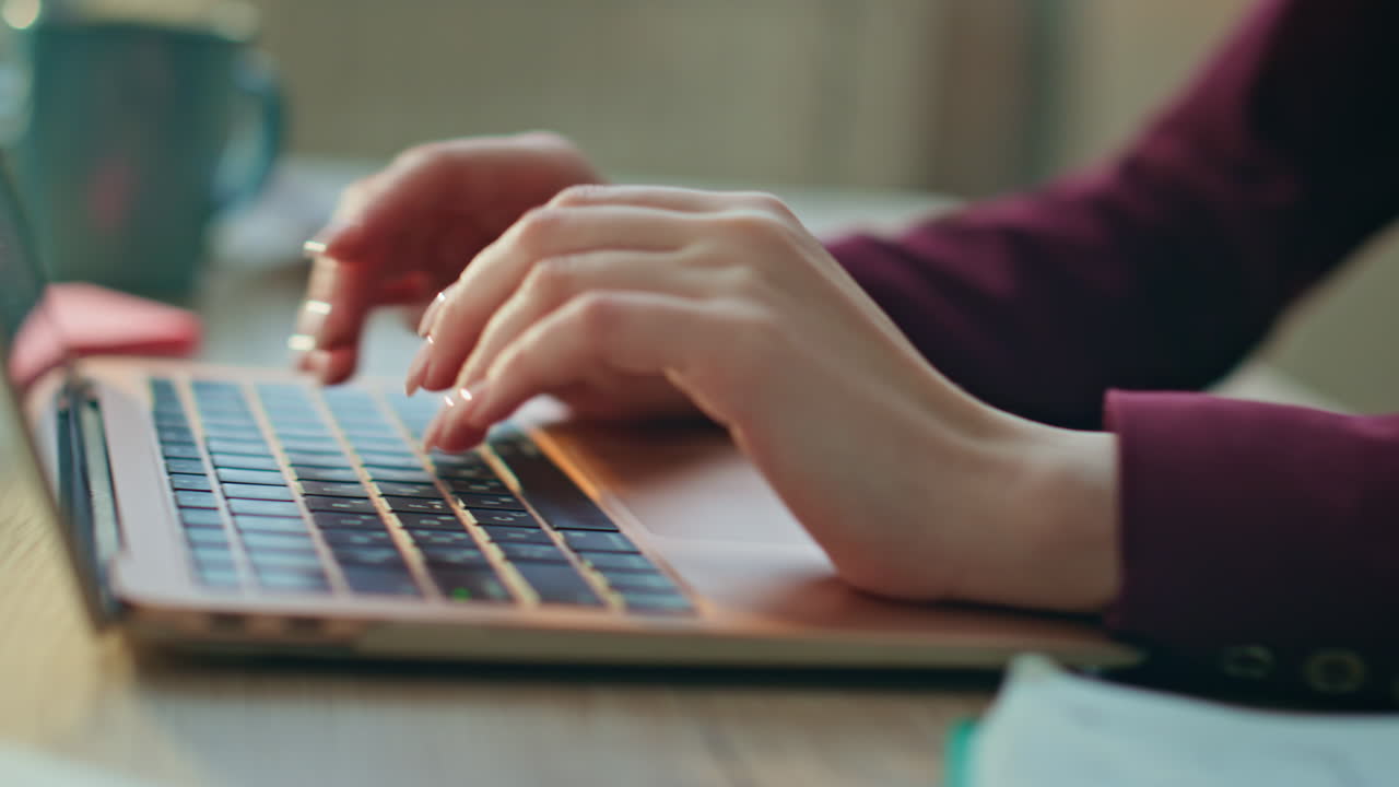 Student hands writing notebook closeup. Woman typing keyboard doing research