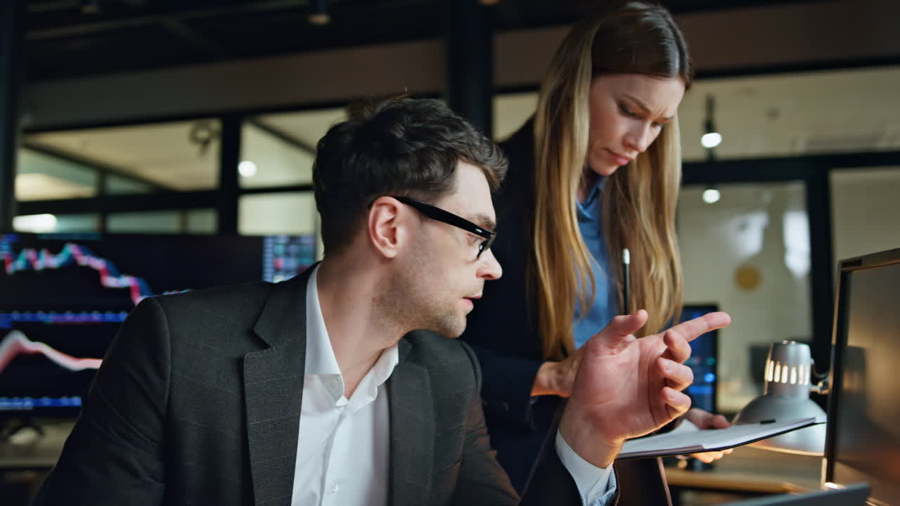 Trading team planning project in office. Pensive stock brokers analysing market