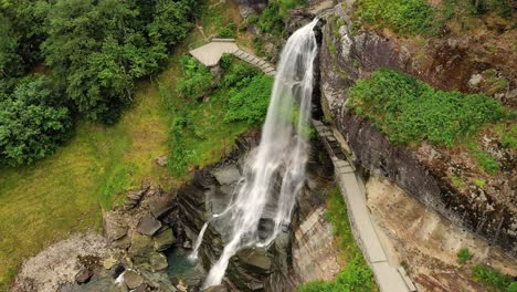 steinsdalsfossen is a waterfall in the village of steine in the municipality of kvam in hordaland county, norway. the waterfall is one of the most visited tourist sites in norway.