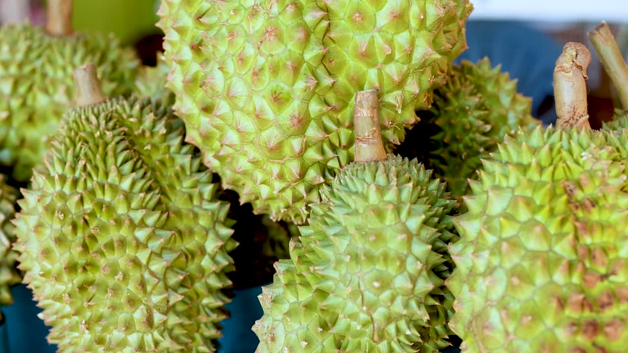 Fresh durians displayed at a floating market