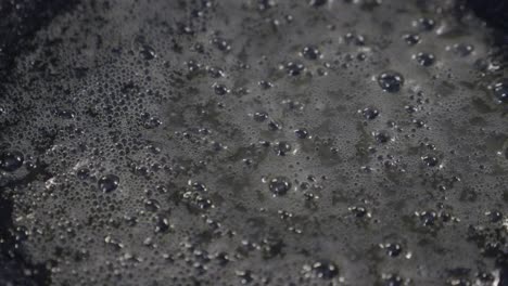 close-up of boiling water with bubbles