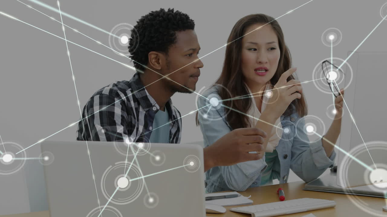 Woman turning glasses starting node map overlay, colleagues leaning and inspecting links for review