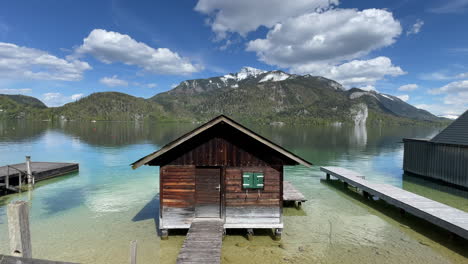 lovely tiny fishing cabin in summer light by the lake wolfgangsee in austria