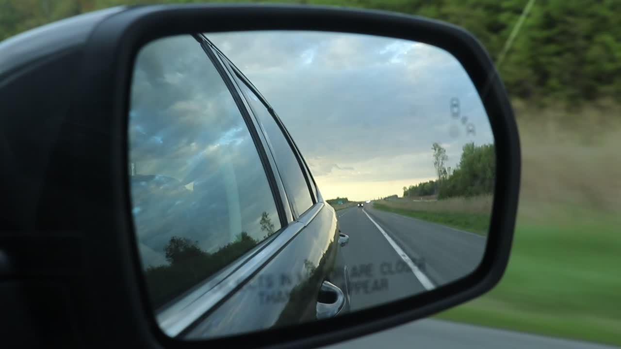 Driving on a Highway - Scenic View from Side Mirror