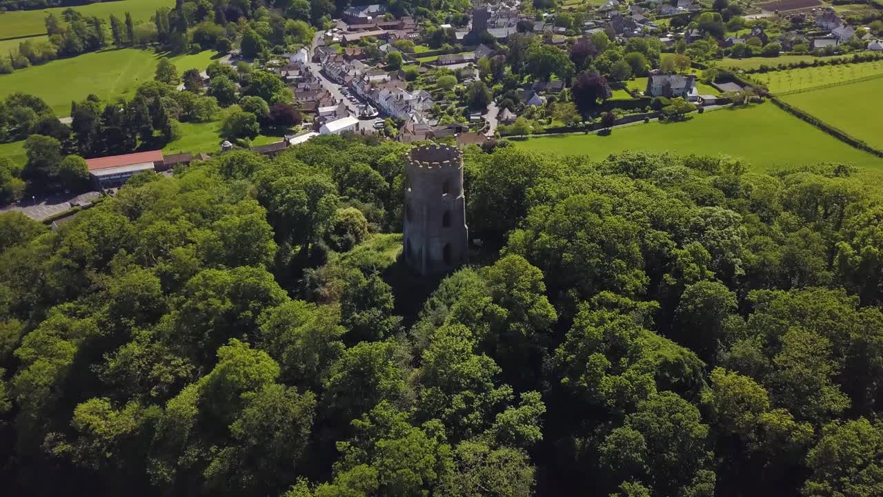 Aerial view of the Dunster Conygar tower and surrounding areas full of trees near Dunster castle, Somerset, England.