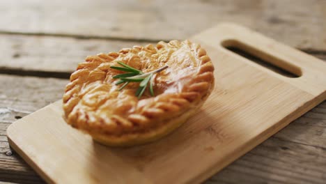 Video-of-pie-seen-from-above-on-wooden-background