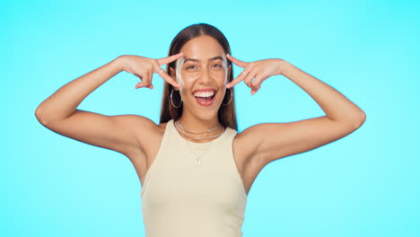 Peace-sign,-smile-and-wink-with-face-of-woman