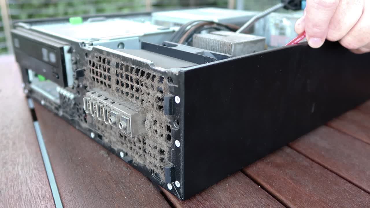 Blowing dust from a computer power supply (PSU) with air