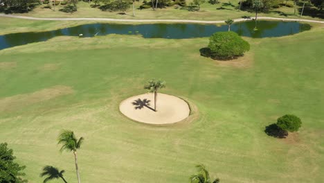 golf club field with playing golfers. aerial top view