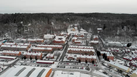 tiny swedish town covered in snow on cold winter day