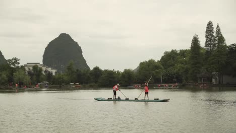 tourists on a sailing boat at the lake guilin china