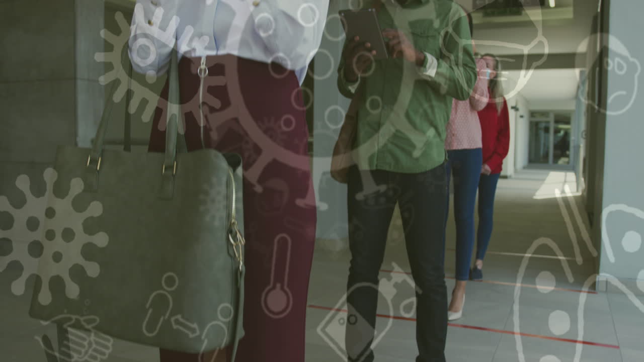 Covid-19 concept icons floating against group of people wearing face masks standing in a queue