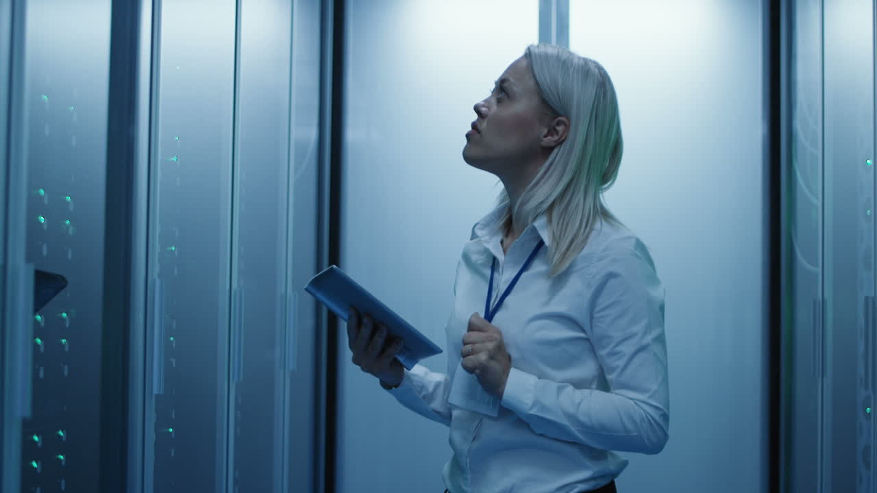 Woman IT professional working in a data center