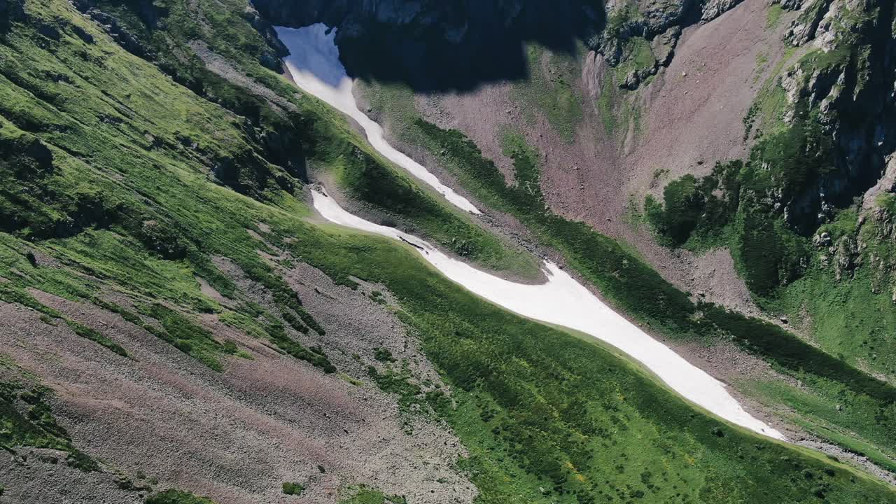 View from the high track in caucasus mountains glaciers, green grass, wild lakes