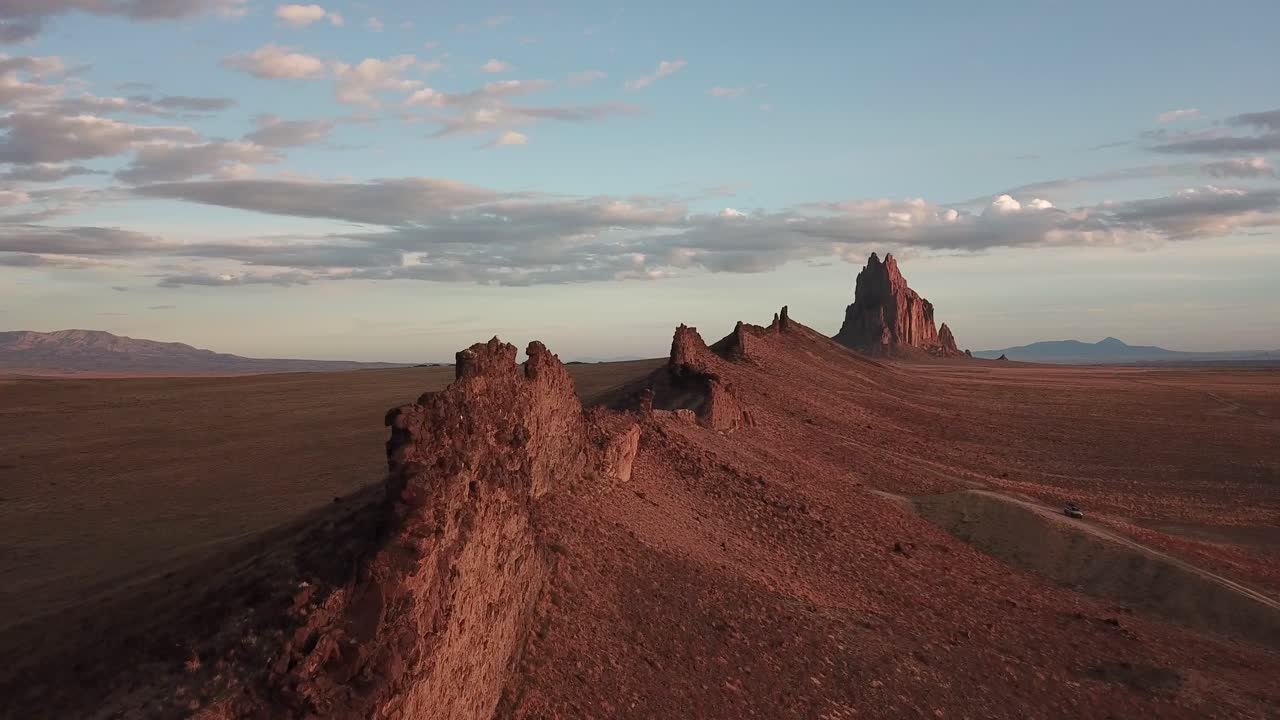Cinematic aerial flight along the formations near Shiprock New Mexico