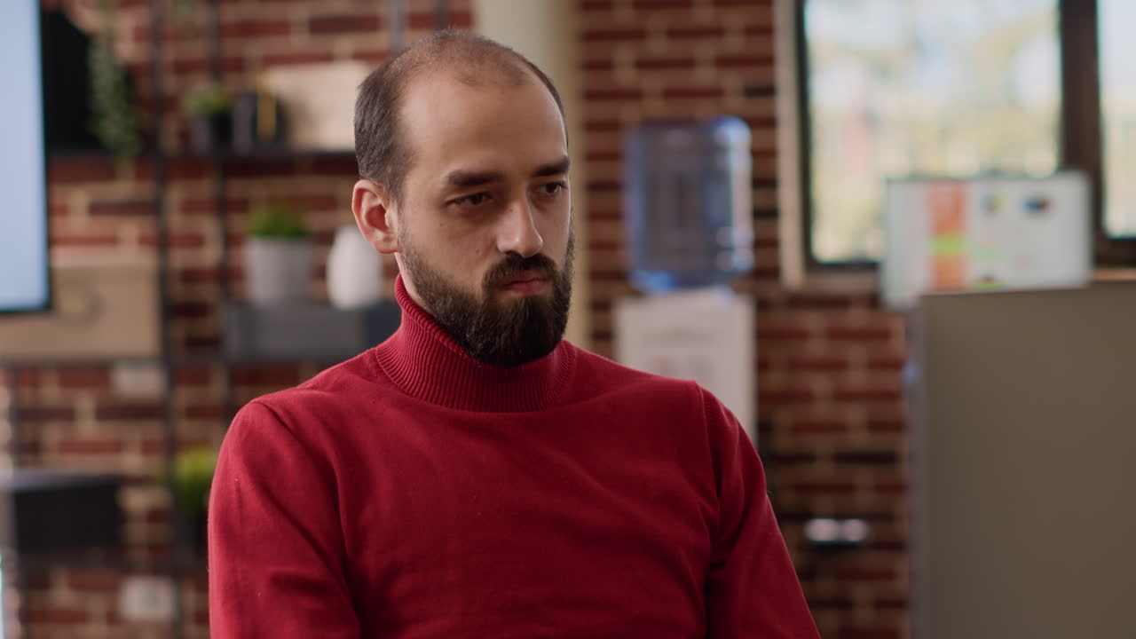 Male office worker using charts analysis on computer