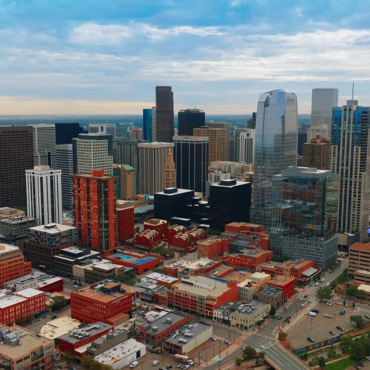Beautiful sight of Denver downtown with varied skyscrapers. Vast scenery of the metropolis on cloudy day. Top view