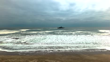 huayquique beach chile iquique building ocean sea traffic tarapaca mountain ocean sea foam boat ship side travelling