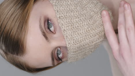 vertical portrait of woman in crochet face mask