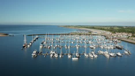 aerial view of yachts and sailboats moored on roompot marina haven near kamperland in zeeland, netherlands