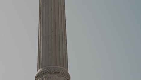 statue in rossio square in lisbon portugal, tilt up view