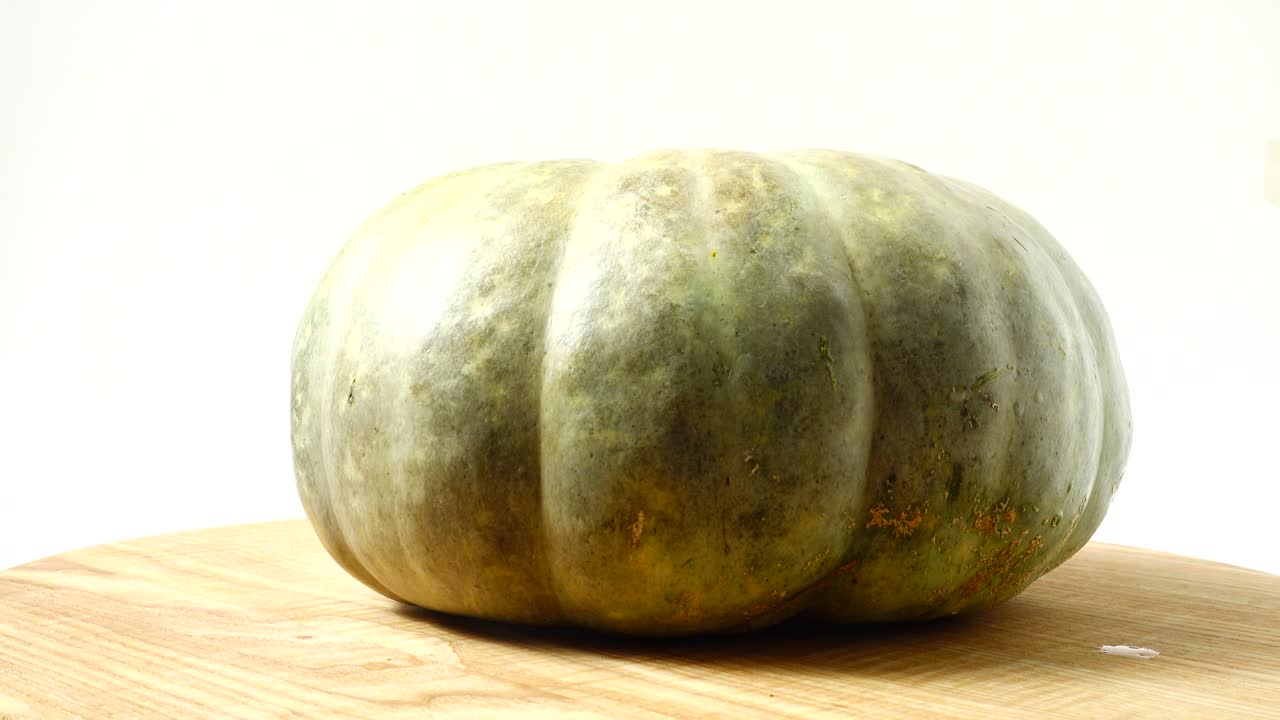 Pumpkin on a kitchen board. Shooting in the movement. Shooting in the movement