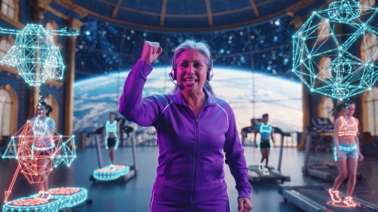 A Motivated Female Fitness Trainer Guides Multiple Participants in a Stellar Virtual Training Environment with Neon-Highlighted Technology and a Cosmic View