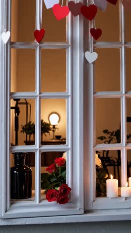 romantic valentine's day window display with roses and candles