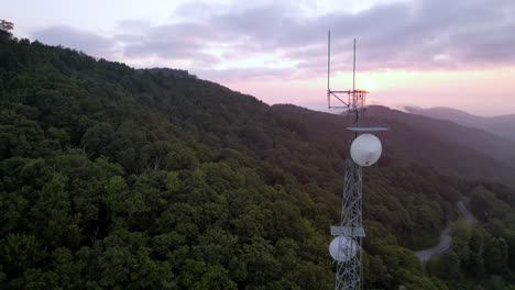 aerial orbit of communications tower near boone nc, north carolina at sunrise