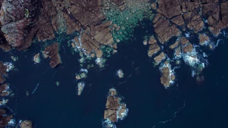 drone-top-shot-of-brittany-coast-in-france-with-rocks-and-deep-blue-water