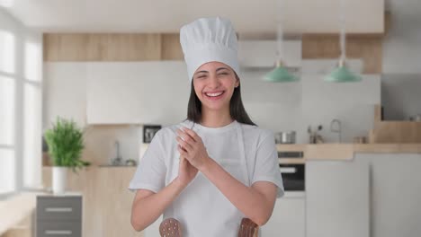 Happy-Indian-female-professional-chef-clapping-and-appreciating