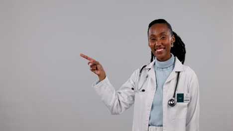 Happy-black-woman,-doctor-and-pointing