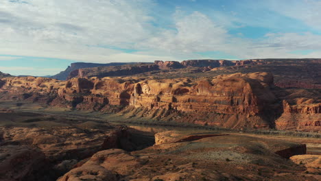 high butte of red rocks monuments of canyon gorge in valley of colorado river in utah, usa