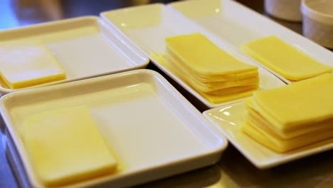 cheeses being served on trays