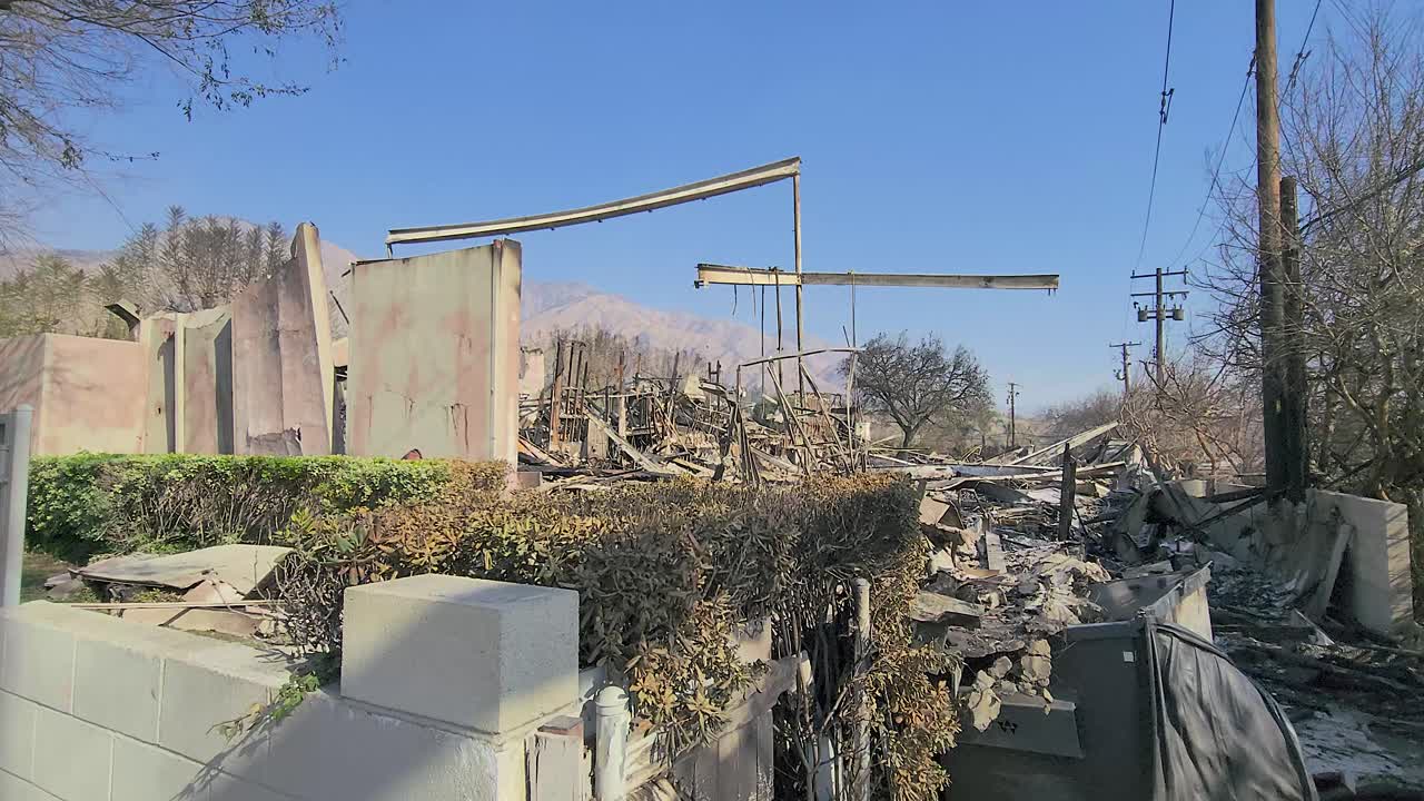Destroyed building after wildfires in Los Angeles, motion view