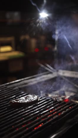 steak grilling at night