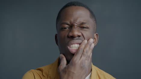 man experiencing tooth pain