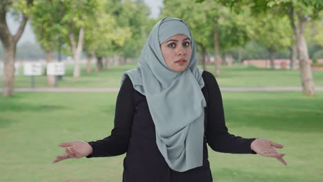 confused muslim woman what question in park