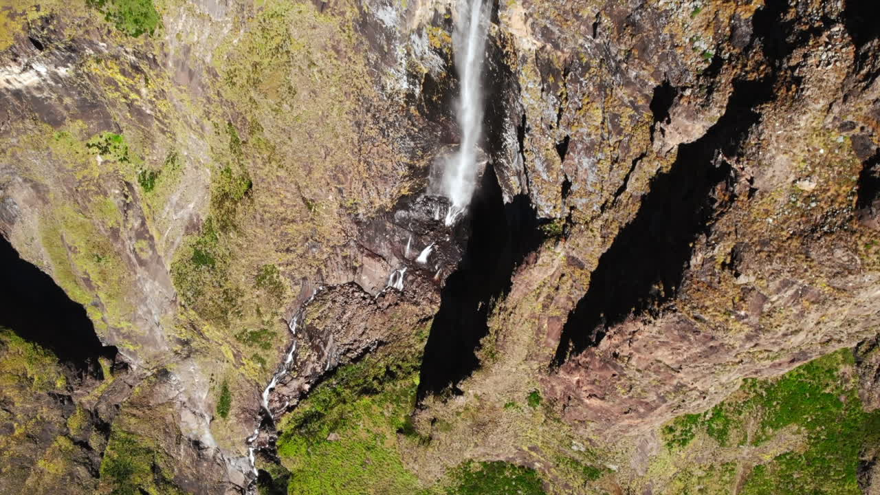 Aerial View of a Waterfall in a Rocky Mountain Landscape