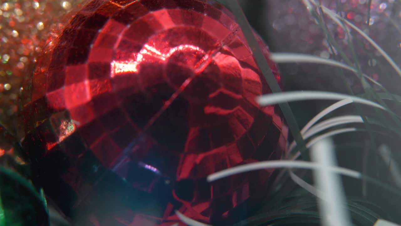 Christmas decoration, colorful crystal ornaments golden, silver and red balls, new year decorated, shiny lights, cinematic close-up Macro tilt down 4K video, beautiful depth of field, bokeh lighting