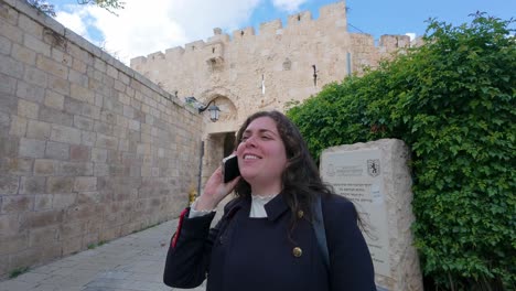 woman talking on phone in jerusalem's old city