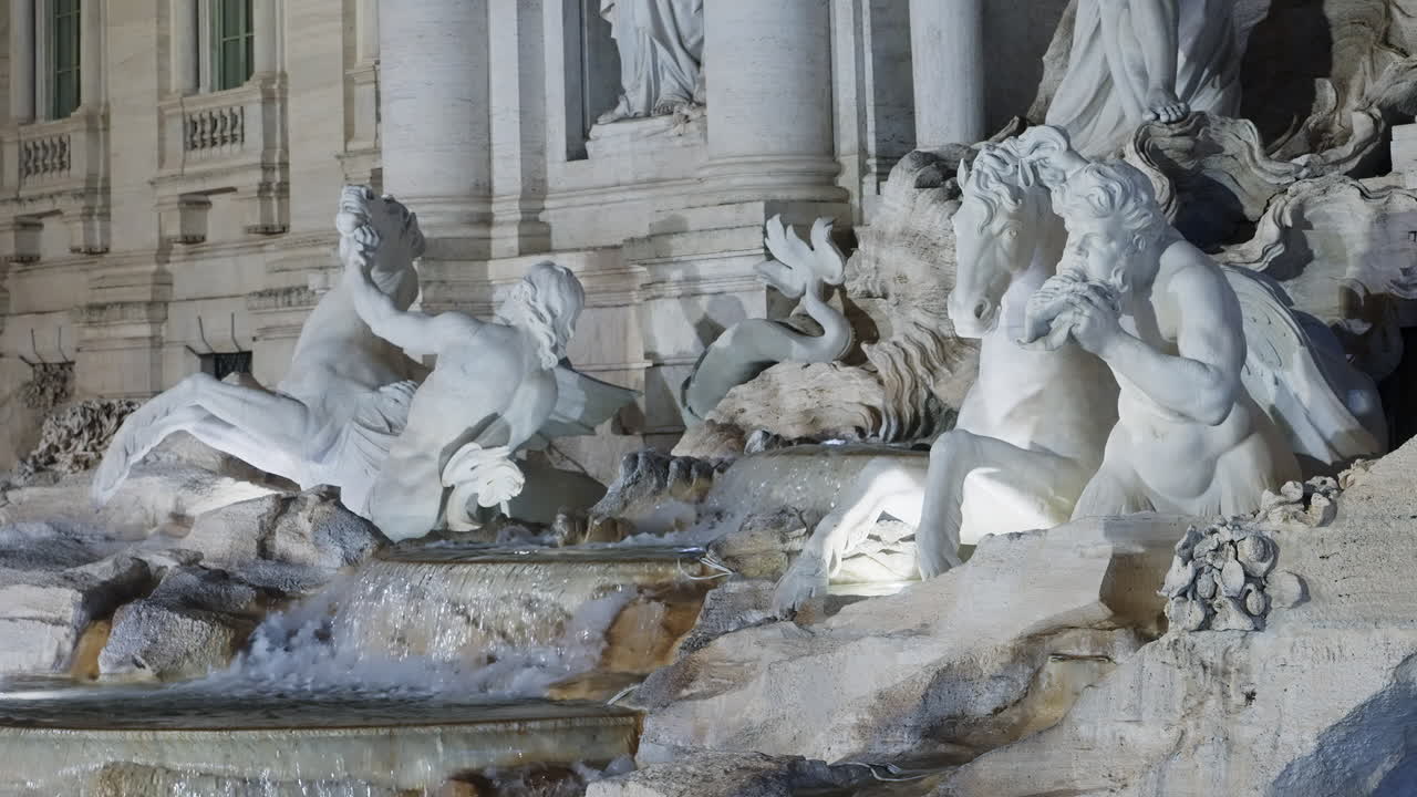 Statues of Fontana di Trevi at night, Rome, Italy