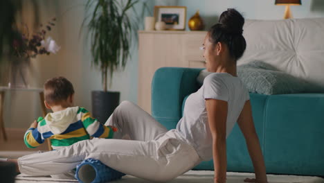 mother and son exercising together at home