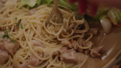 eating healthy pasta with a fork. close up