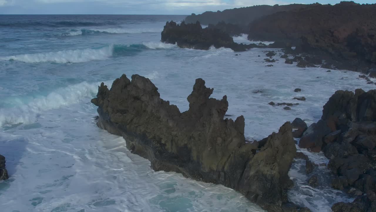 Aerial drone view of mountain sea and volcanoes in Lanzarote, Canary Islands, Spain
