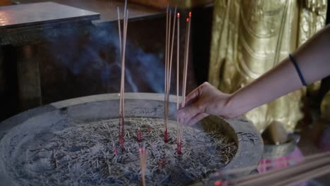 place joss stick to the prayer platform