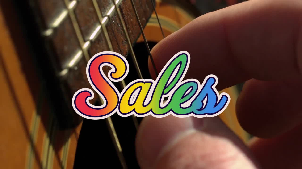 animación de texto de ventas sobre la mano tocando la guitarra