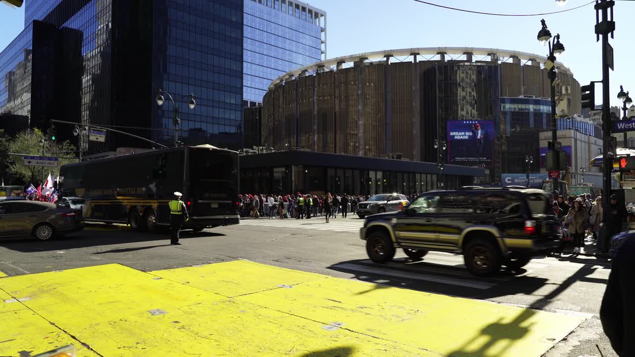 In the heart of New York, people unite near Madison Square Garden, showing their unwavering support for Trump under the warm sunlight